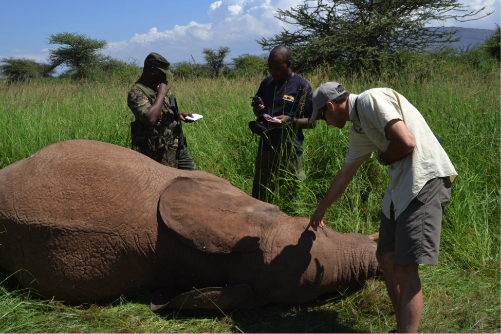 Pointing out entry wound from the gunshot that killed this young male